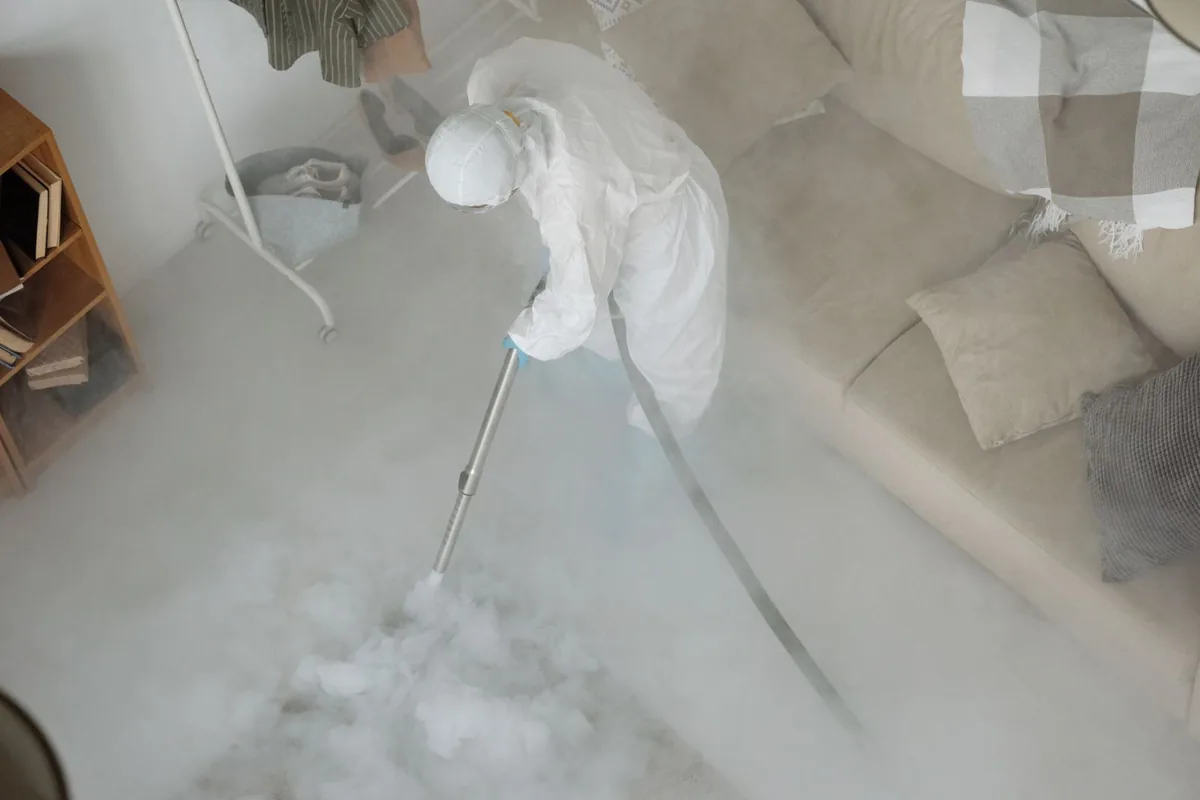 Biohazard cleanup technician in protective equipment, Kutztown University, PA